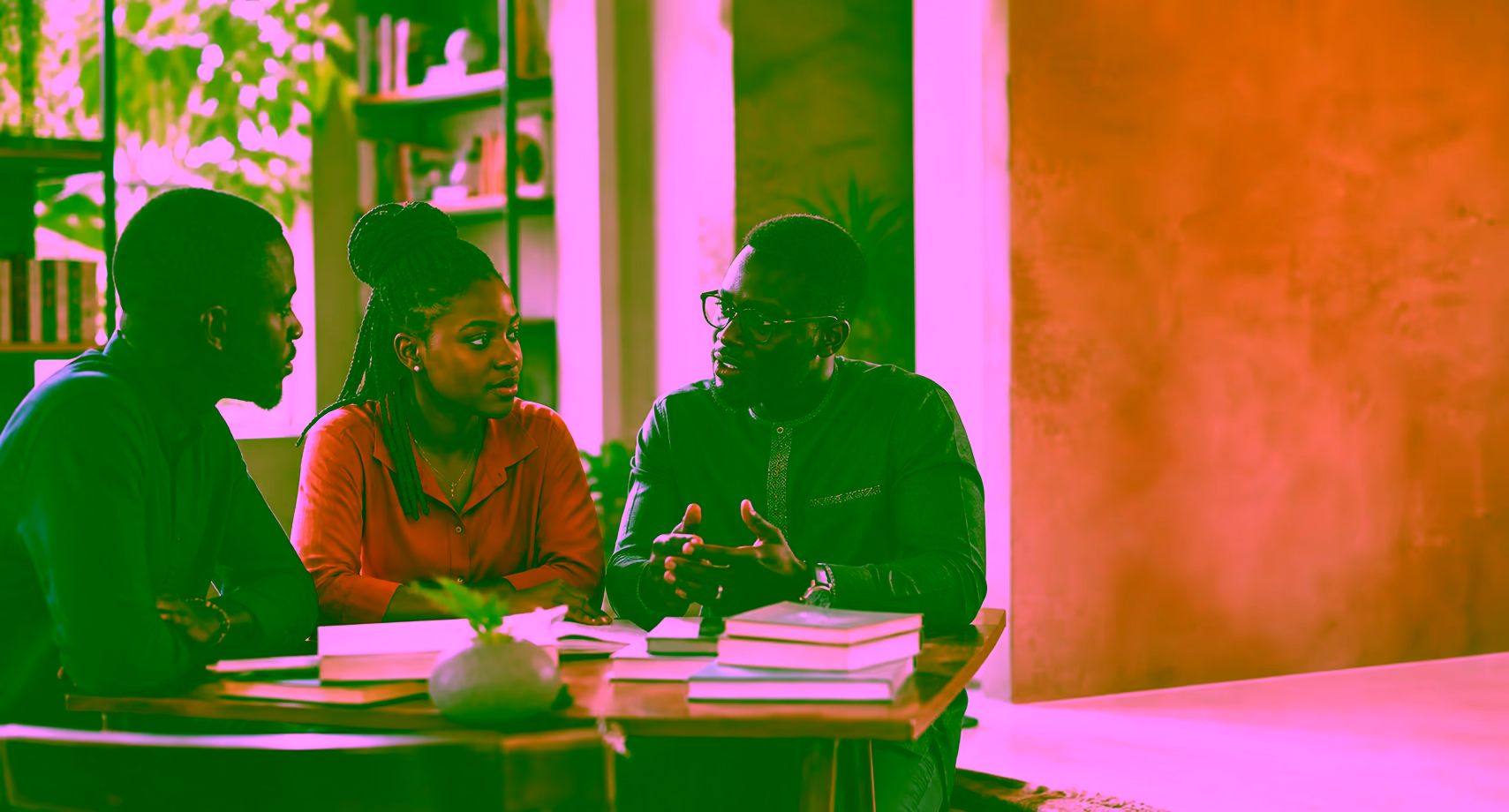 Young Ghanaian professionals in a thoughtful community conversation